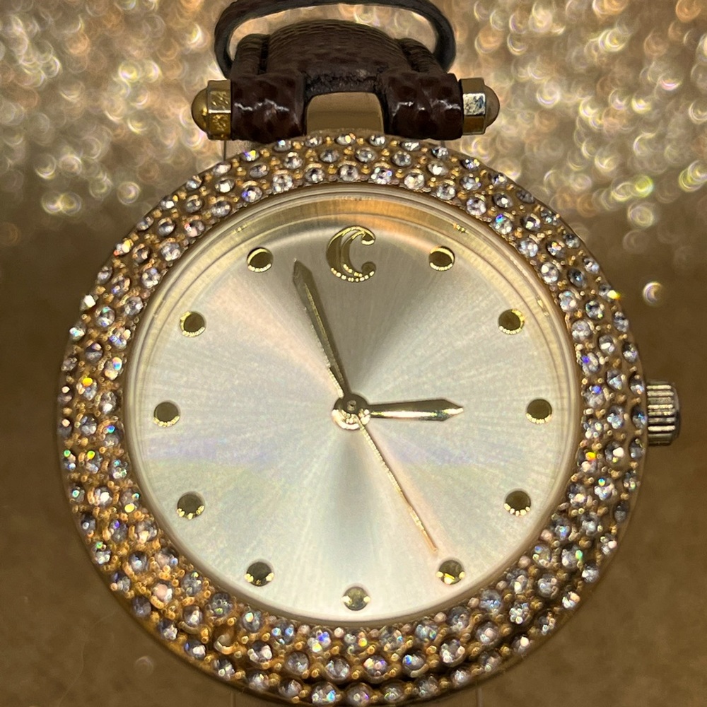 CHARMING CHARLIE! elegant gold watch face and gemstone bezel with a brown band